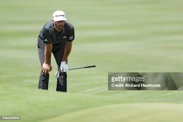 Dustin Johnson of the United States reacts on the 14th hole during the second round of the World Golf Championships-Dell Match Play at Austin Country...