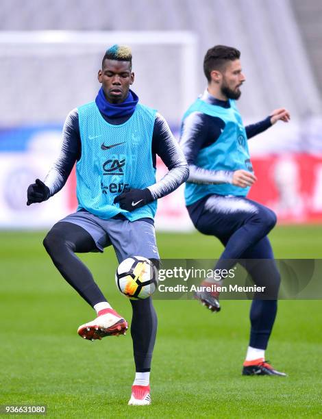 Paul Pogba warms up during a France football team training session before the friendly match against Colombia on March 22, 2018 in Paris, France.