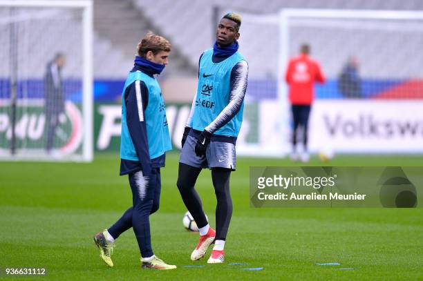 Antoine Griezmann and Paul Pogba warm up during a France football team training session before the friendly match against Colombia on March 22, 2018...