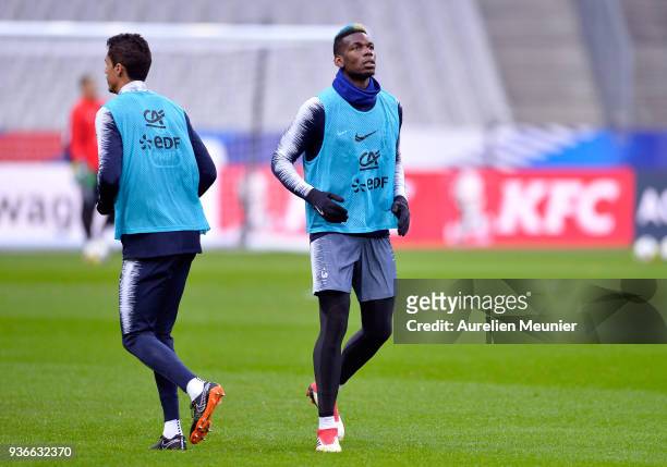 Paul Pogba warms up during a France football team training session before the friendly match against Colombia on March 22, 2018 in Paris, France.