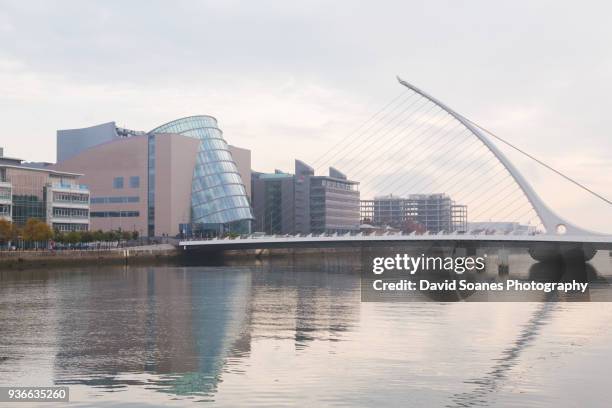 the convention centre and samuel beckett bridge in dublin, ireland - convention centre dublin stock pictures, royalty-free photos & images