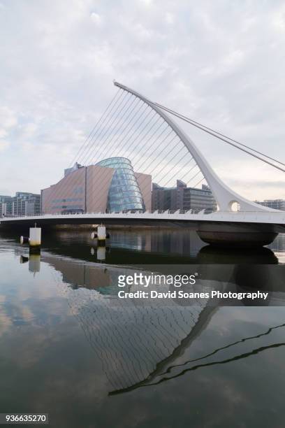 the convention centre and samuel beckett bridge in dublin, ireland - convention centre dublin stock pictures, royalty-free photos & images