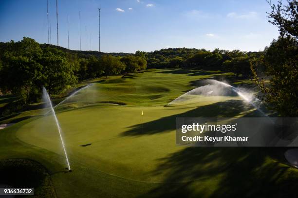 Course scenic view of sprinklers spraying the fifth hole green during practice for the World Golf Championships - Dell Technologies Match Play at...