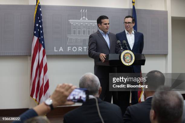 Ricardo Rossello, governor of Puerto Rico, speaks while Steve Mnuchin, U.S. Treasury secretary, right, listens during a press conference in San Juan,...