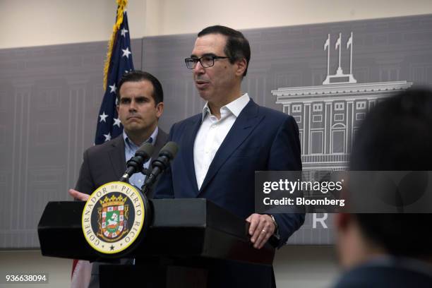 Steve Mnuchin, U.S. Treasury secretary, speaks while Ricardo Rossello, governor of Puerto Rico, left, listens during a press conference in San Juan,...