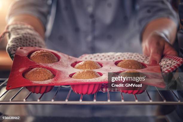 baking small bunt cakes for easter - bunt cake stock pictures, royalty-free photos & images