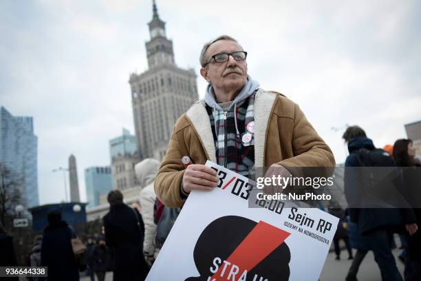 Members of Amnesty International are seen collecting signatures against the proposed abortion law in Warsaw, Poland on March 22, 2018. The proposed...