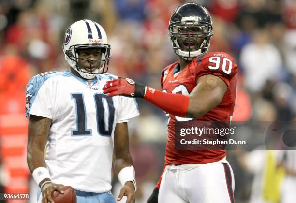 Quarterback Vince Young of the Tennessee Titans and defensive end Mario Williams of the Houston Texans on the field on November 23, 2009 at Reliant...