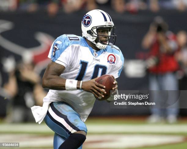 Quarterback Vince Young of the Tennessee Titans carries the ball against the Houston Texans on November 23, 2009 at Reliant Stadium in Houston,...