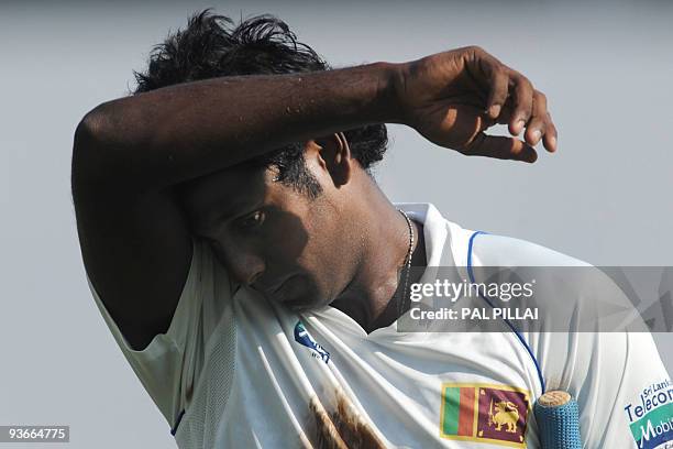 Sri Lankan cricketer Angelo Mathews gestures as he walks back to the pavilion after missing out on a century during the second day of the third Test...