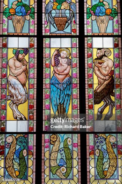 Contemporary stained glass windows by V Stanek and J Sebek featuring cherubs in a garden on the upper floor of the Lucerna Cinema, on 19th March in...