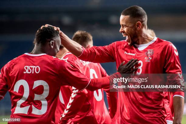 Denmark's Pione Sisto celebrates with Denmark's Mathias Zanka Joergensen after scoring a goal during the Friendly football match between Denmark and...