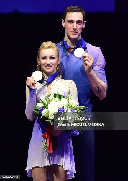 Gold medal Germany's Aljona Savchenko and Bruno Massot pose on the podium during the medal ceremony on March 22, 2018 during the Pairs Free Skate at...