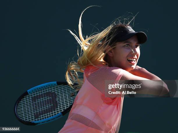 Oceane Dodin of France plays a shot against Simona Halep of Romania during Day 4 of the Miami Open at the Crandon Park Tennis Center on March 22,...