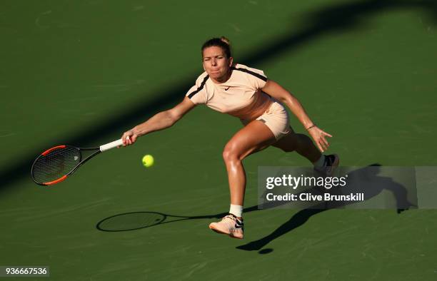 Simona Halep of Romania plays a forehand against Oceane Dodin of France in their second round match during the Miami Open Presented by Itau at...