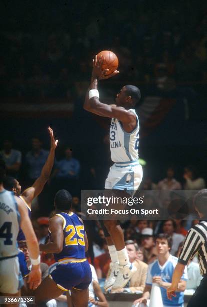 Michael Jordan of the North Carolina Tar Heels shoots the ball during an NCAA basketball game circa 1982 at the Greensboro Coliseum in Greensboro,...