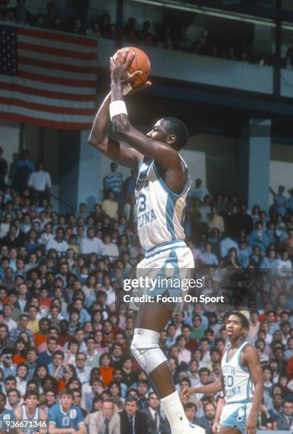 Michael Jordan of the North Carolina Tar Heels shoots the ball during an NCAA basketball game circa 1982 at the Greensboro Coliseum in Greensboro,...