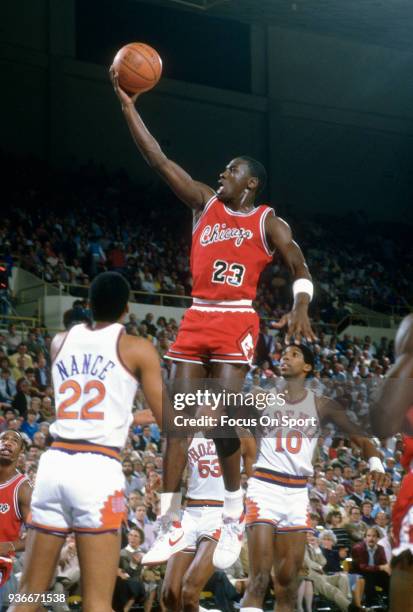 Michael Jordan of the Chicago Bulls goes in for a layup against the Phoenix Suns during an NBA basketball game circa 1987 at the Arizona Veterans...