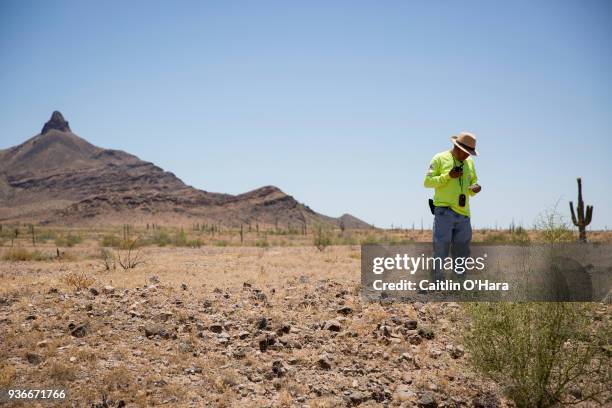 Aguílas del Desierto search and rescue crew member makes a radio call back to president Ely Ortiz, letting him know they found another set of remains...