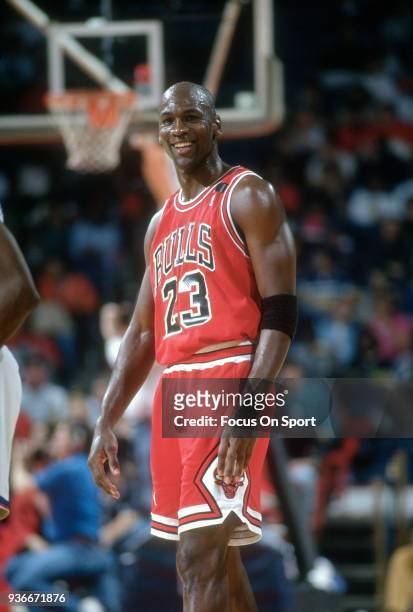 Michael Jordan of the Chicago Bulls looks on against the Washington Bullets during an NBA basketball game circa 1992 at the Capital Centre in...