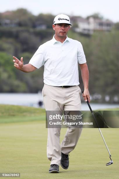 Chez Reavie of the United States reacts on the 14th green during the second round of the World Golf Championships-Dell Match Play at Austin Country...