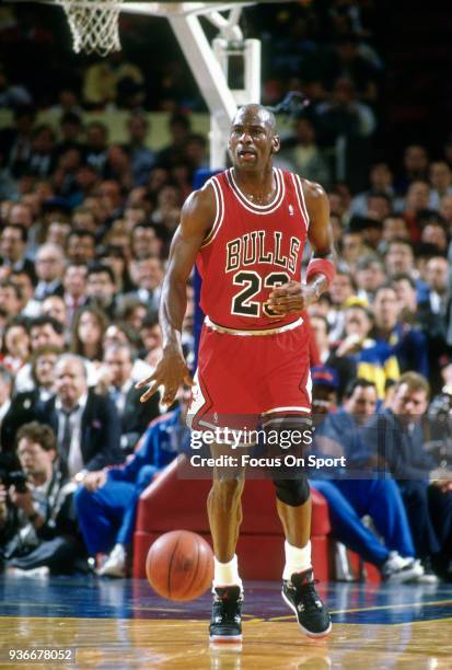Michael Jordan of the Chicago Bulls dribbles the ball up court against the New York Knicks during an NBA Basketball game circa 1989 at Madison Square...