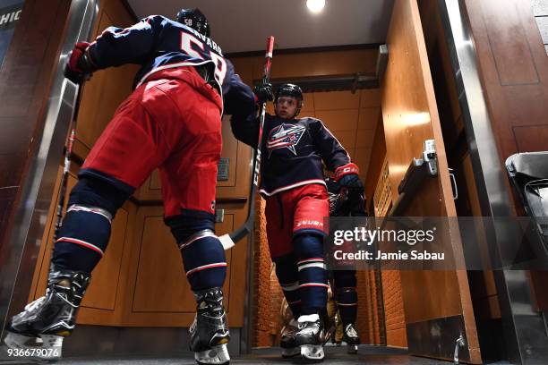 David Savard and Artemi Panarin of the Columbus Blue Jackets head to the ice for pregame warmups prior to a game against the Florida Panthers on...