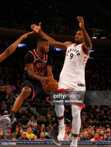 Emmanuel Mudiay of the New York Knicks in action against Serge Ibaka of the Toronto Raptors at Madison Square Garden on March 11, 2018 in New York...