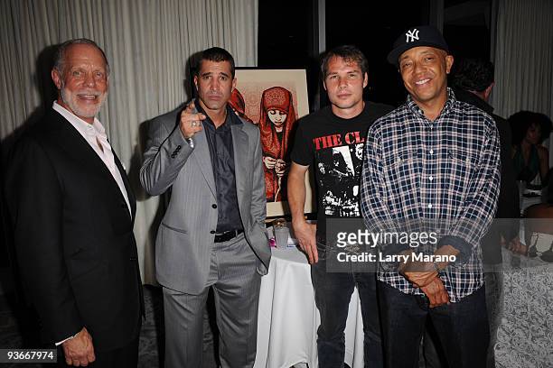 Fred Kleisner, Scott Stapp, Frank Shepard Fairey and Russell Simmons pose at the Rush Philanthropic Arts foundation at Mondrian Miami on December 2,...