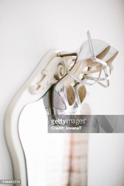 lovely wedding silver high heels on mirror - jovanat stock pictures, royalty-free photos & images