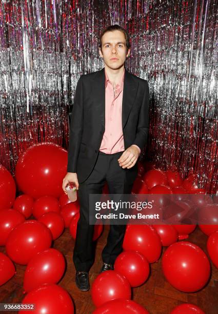 James Righton, drinking an Absolut Elyx cocktail, attends the Self-Portrait store opening after-party at Central St Martins on March 22, 2018 in...