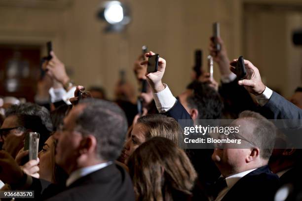 Attendees take photographs with their mobile phones as U.S. President Donald Trump, not pictured, arrives to speak during a Greek Independence Day...