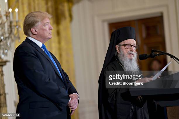Archbishop Demetrios of America, elder archbishop of the Greek Orthodox Archdiocese of America, speaks as U.S. President Donald Trump, left, listens...