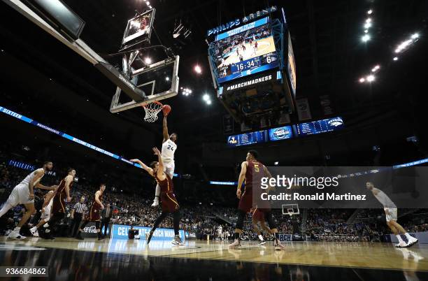 Jordan Caroline of the Nevada Wolf Pack goes up for a dunk against Cameron Krutwig of the Loyola Ramblers in the first half during the 2018 NCAA...