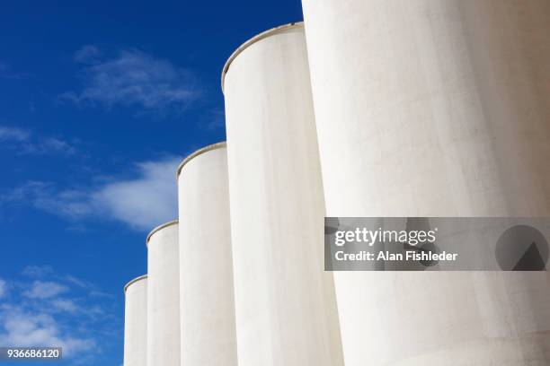 grain elevators against sky - granary stock pictures, royalty-free photos & images