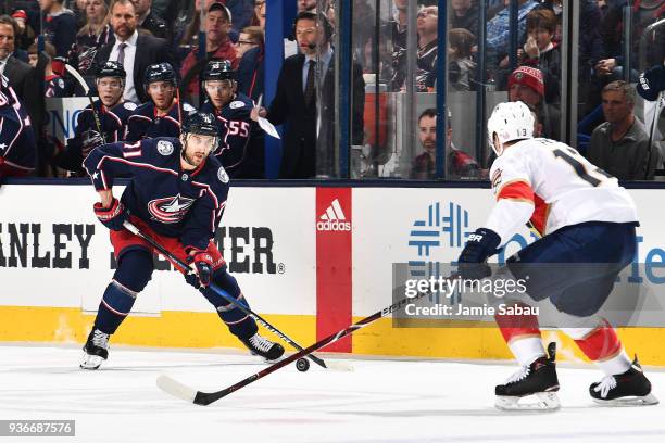 Nick Foligno of the Columbus Blue Jackets skates with the puck as Mark Pysyk of the Florida Panthers defends during the first period of a game on...
