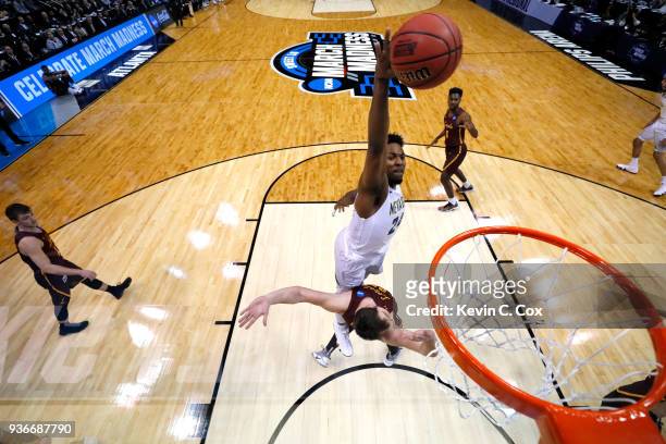 Jordan Caroline of the Nevada Wolf Pack goes up for a dunk against Cameron Krutwig of the Loyola Ramblers in the first half during the 2018 NCAA...