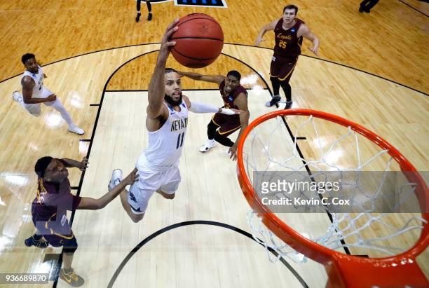 Cody Martin of the Nevada Wolf Pack goes up for a dunk in the first half against the Loyola Ramblers during the 2018 NCAA Men's Basketball Tournament...