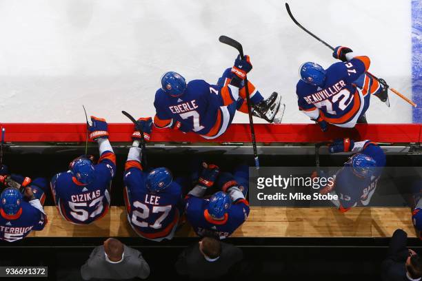 Jordan Eberle and Anthony Beauvillier of the New York Islanders hop over the boards for a line change during the first period against the Tampa Bay...