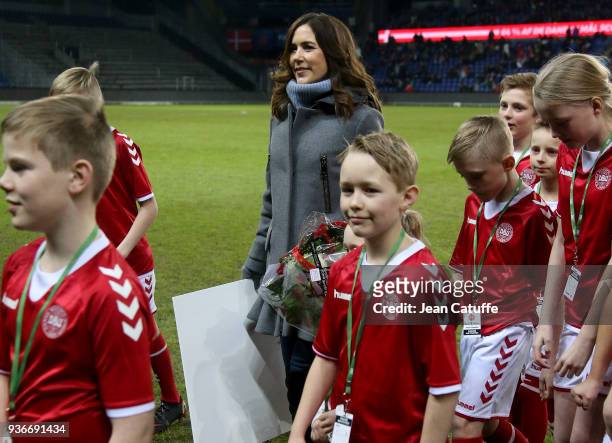 Crown Princess Mary of Denmark receives from Danish Football Association DBU President Jesper Moller a check of 50 000 euros from 'UEFA Foundation...