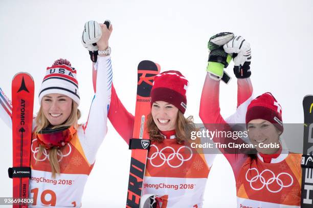 Gold medal winner Michelle Gisin from Switzerland with silver medalist Mikaela Shiffrin of the United States and bronze medalist Wendy Holdener from...