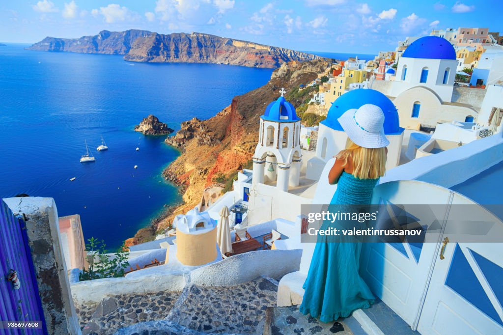 Blond woman looking at view in Santorini