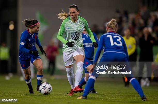 Sara Bjoerk Gunnarsdottir of VfL Wolfsburg is challenged by Petra Divisova of Slavia Praha during the UEFA Women's Champions League Quarter Final...