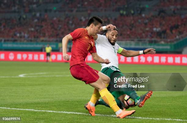 Lei Wu of China and Ashley Williams of Wales in action during 2018 China Cup International Football Championship between China and Wales at Guangxi...