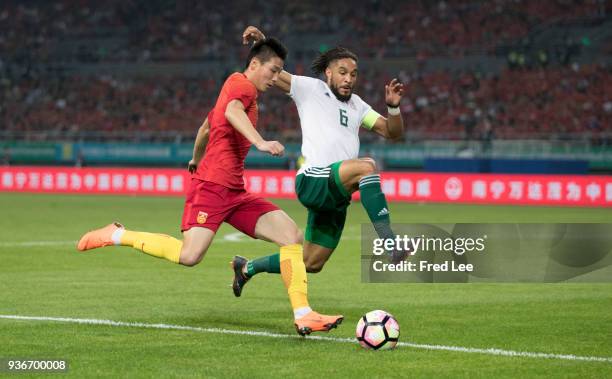 Lei Wu of China and Ashley Williams of Wales in action during 2018 China Cup International Football Championship between China and Wales at Guangxi...