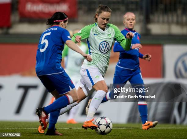 Caroline Graham Hansen of VfL Wolfsburg is challenged by Veronika Pink of of Slavia Praha during the UEFA Women's Champions League Quarter Final...