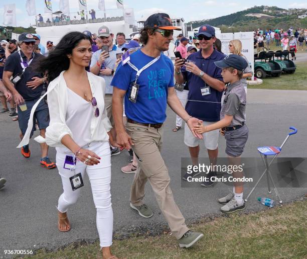 Matthew McConaughey and his wife Camila watch some golf during round two of the World Golf Championships - Dell Technologies Match Play at Austin...