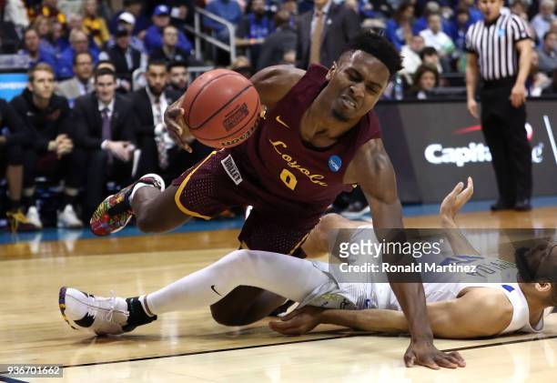 Donte Ingram of the Loyola Ramblers collides with Caleb Martin of the Nevada Wolf Pack in the second half during the 2018 NCAA Men's Basketball...