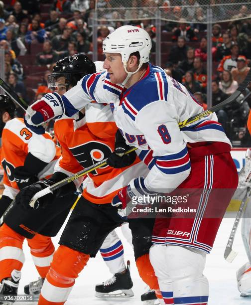 Brandon Manning of the Philadelphia Flyers battles for position with Cody McCleod of the New York Rangers on March 22, 2018 at the Wells Fargo Center...