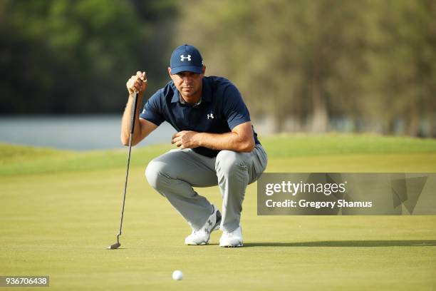 Gary Woodland of the United States lines up a putt on the 14th green during the second round of the World Golf Championships-Dell Match Play at...